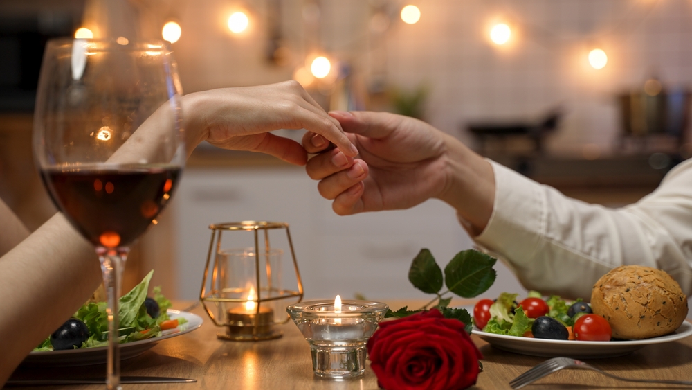 a photo of a couple enjoying a dinner out for Valentine's Day.