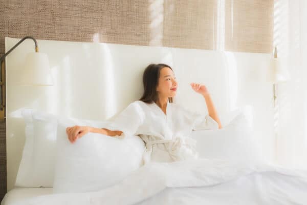 woman lying on bed