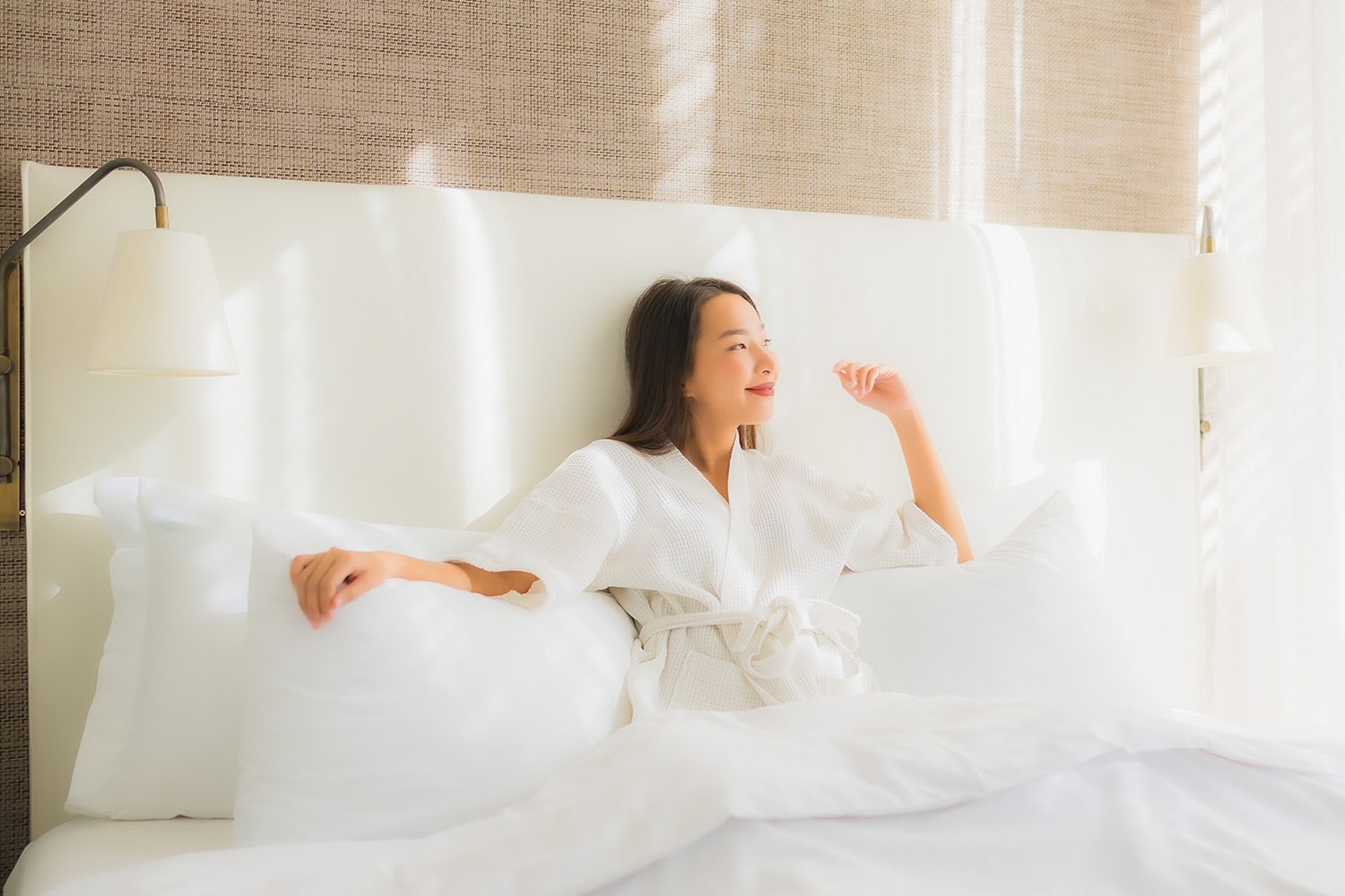 woman lying on bed